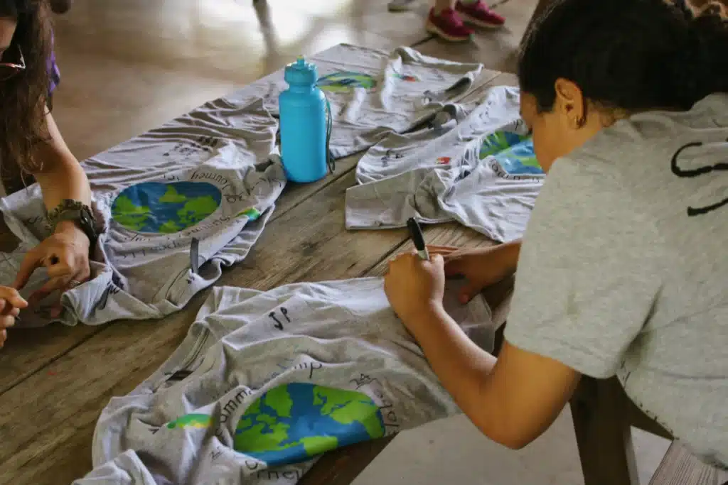 signing shirts at summer camp